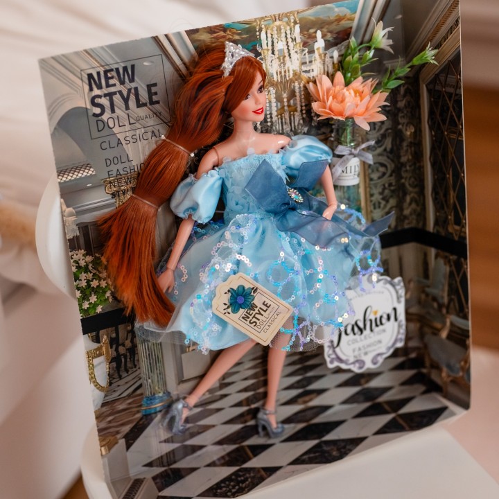 Emi doll in a blue dress - an elegant doll for girls Woopie
