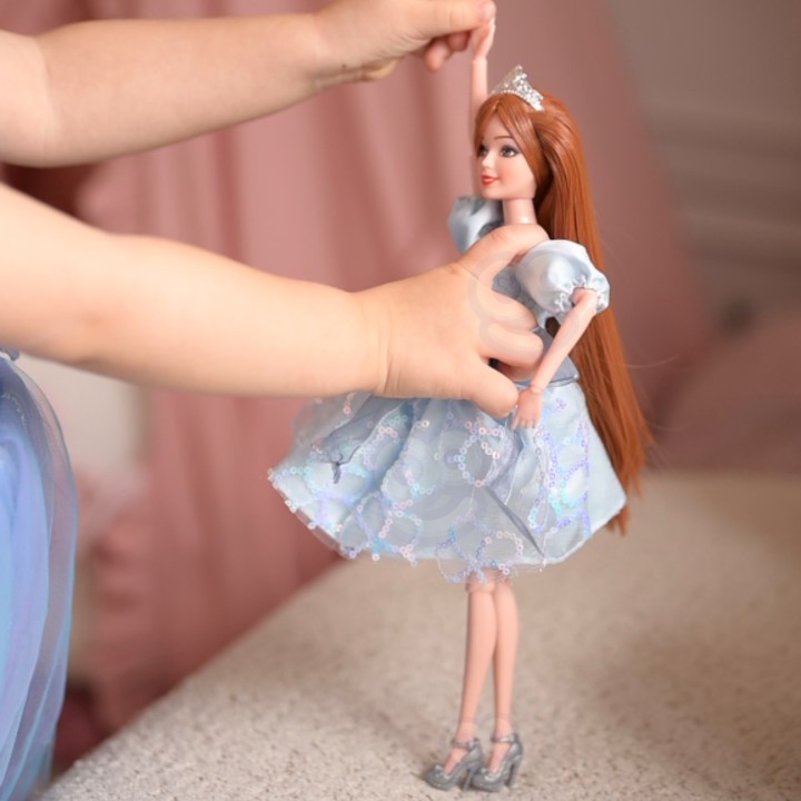 Emi doll in a blue dress - an elegant doll for girls Woopie