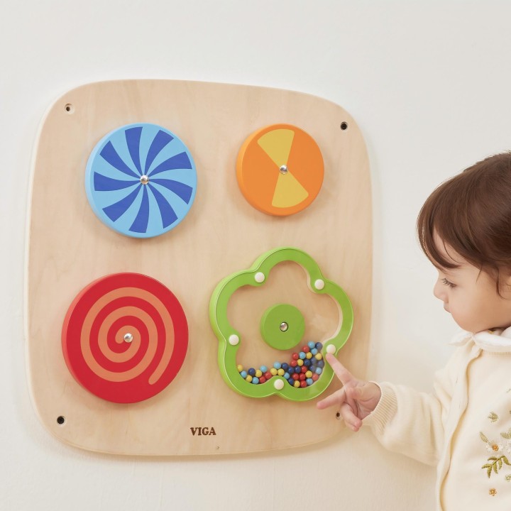 Wall panel with rotating discs and illusions for children – Viga